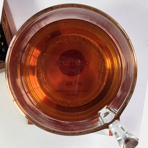 Chai loose leaf tea brewed in a cup with milk