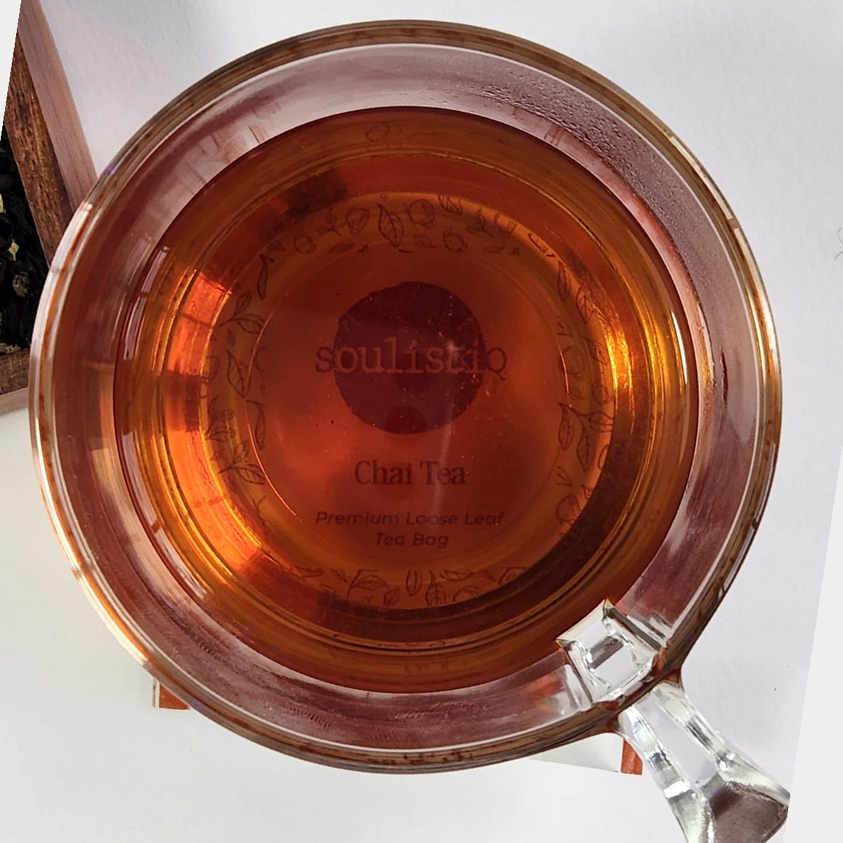 Chai loose leaf tea brewed in a cup with milk